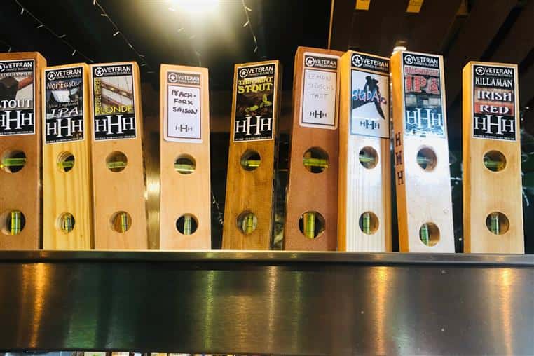 bar tap handles for Huske Brewing Company shaped like levels.